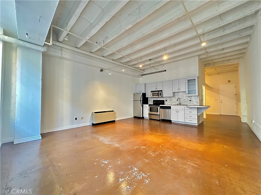 a view of a livingroom with chairs