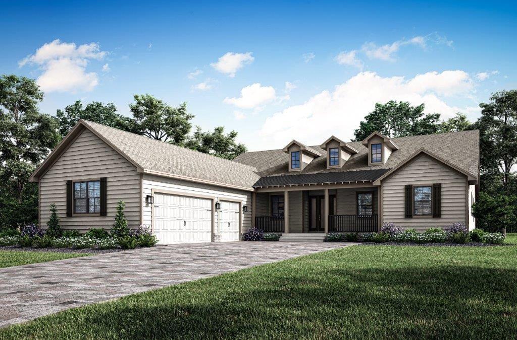 a front view of a house with a garden and yard