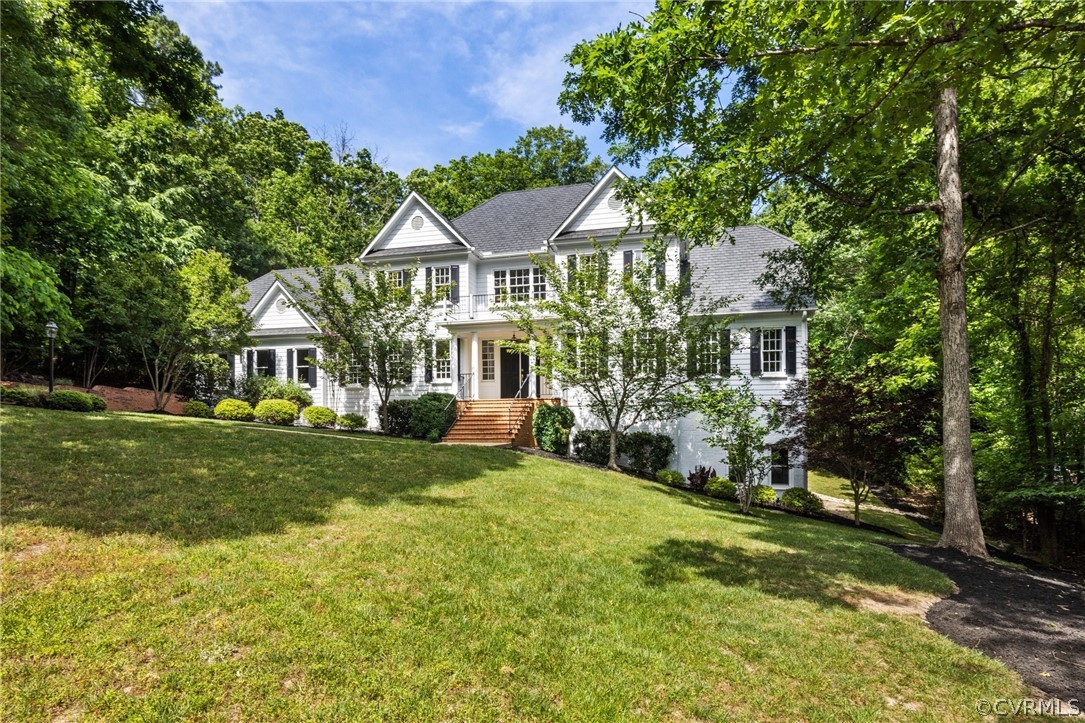 a front view of a house with a yard