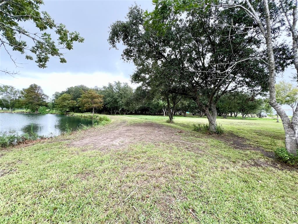 a view of a lake with a yard