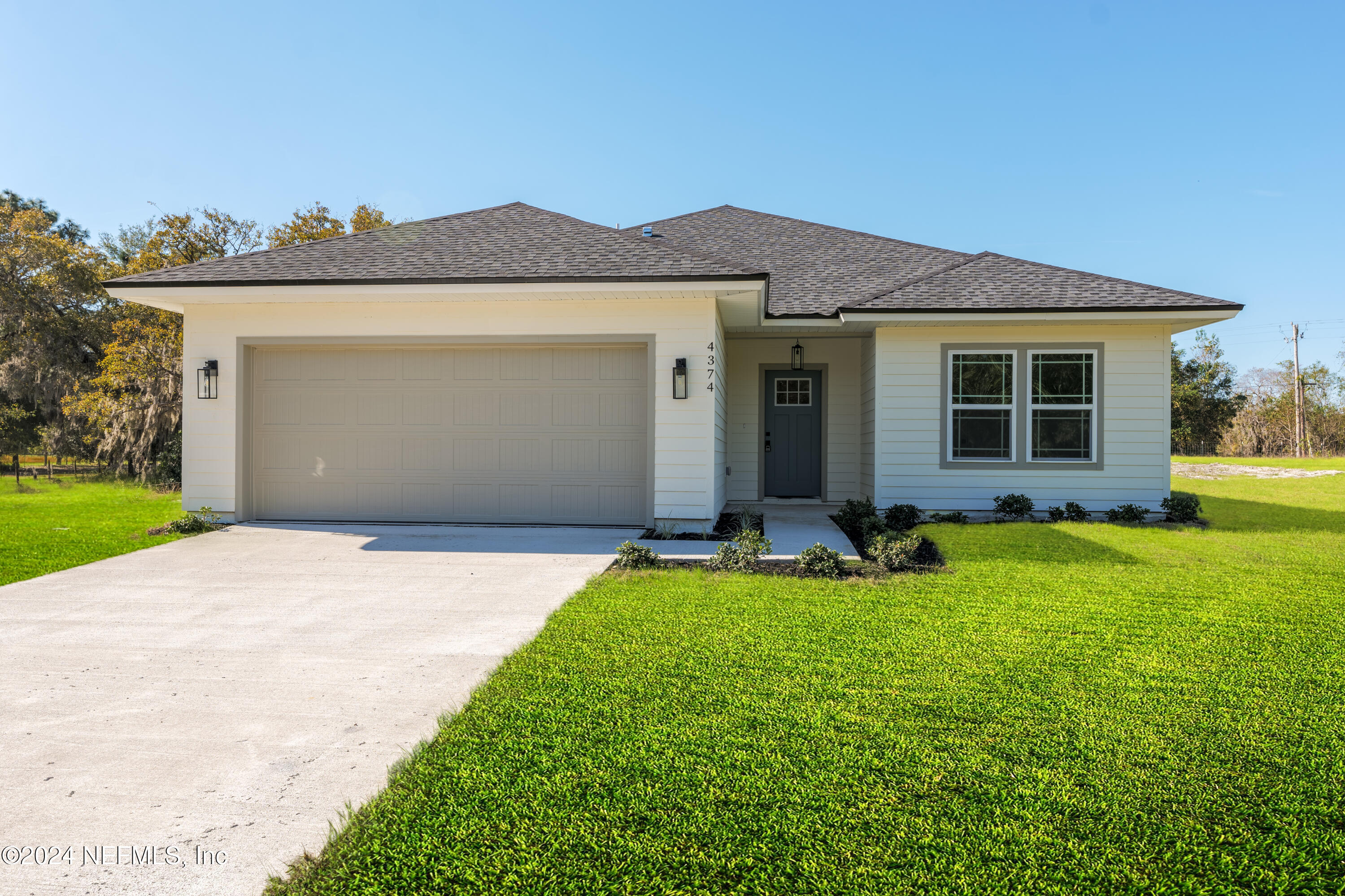 front view of a house with a yard