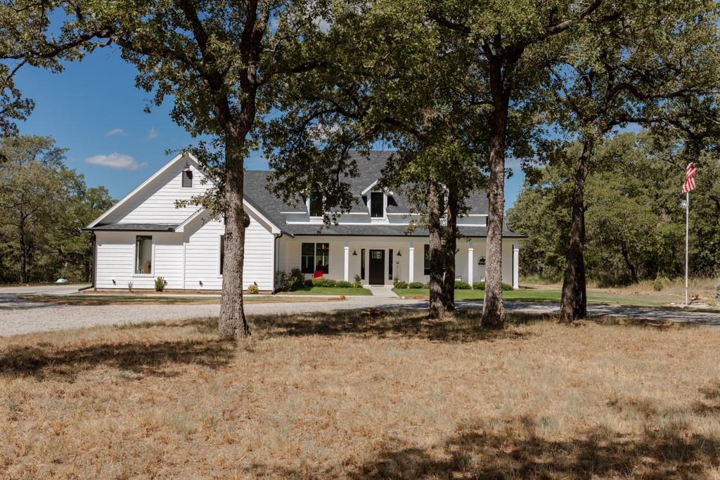 a house with trees in the background