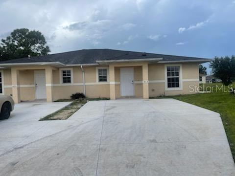 front view of a house with a yard