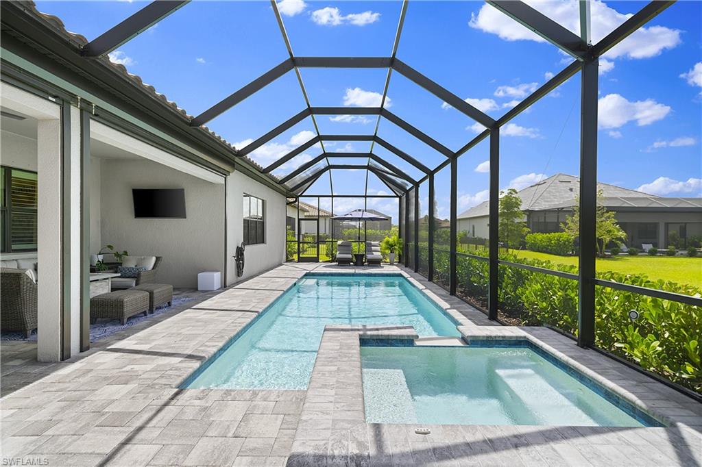 a view of swimming pool with seating space