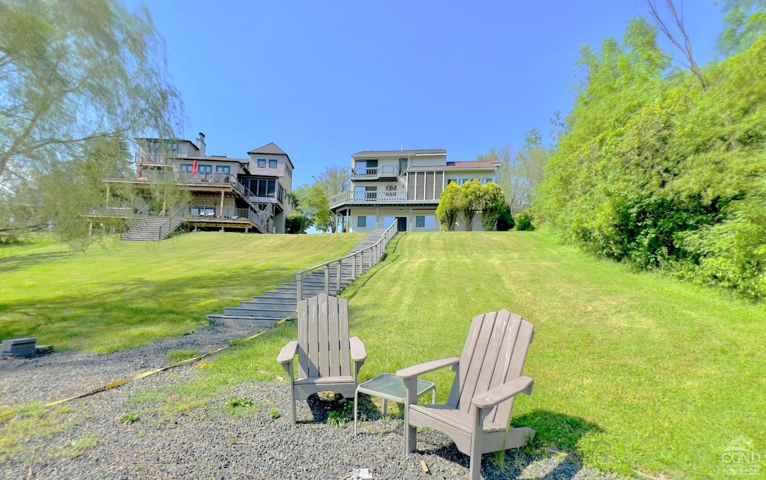 a view of a house with a backyard