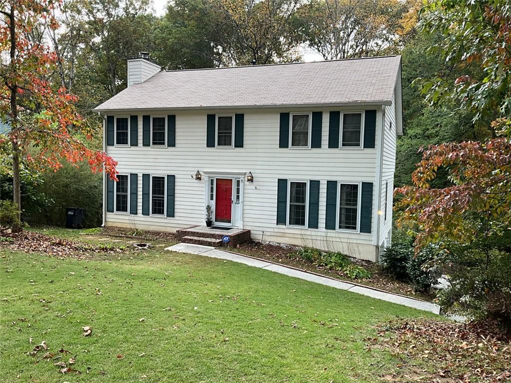 a front view of a house with a yard