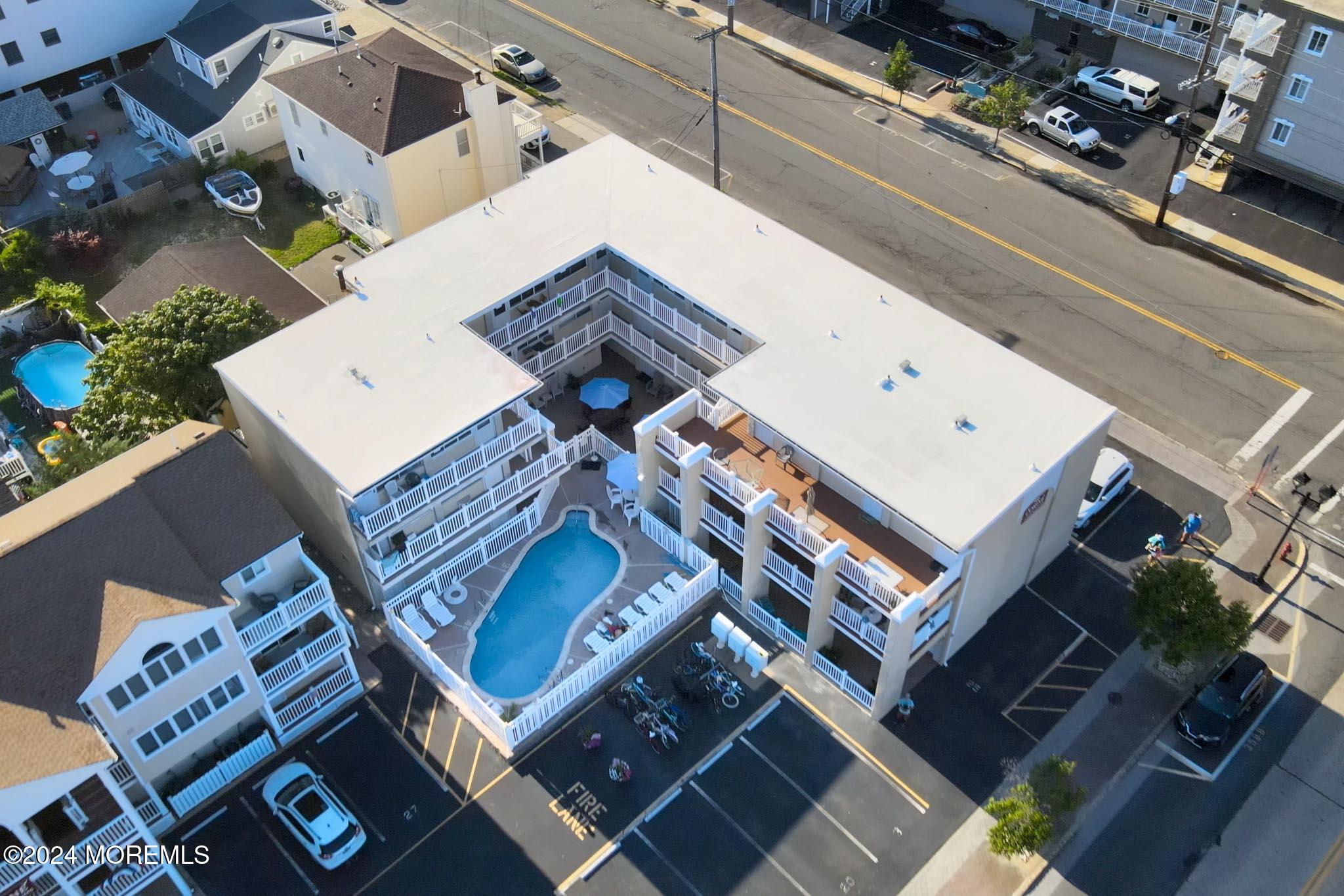 an aerial view of a house with a roof deck