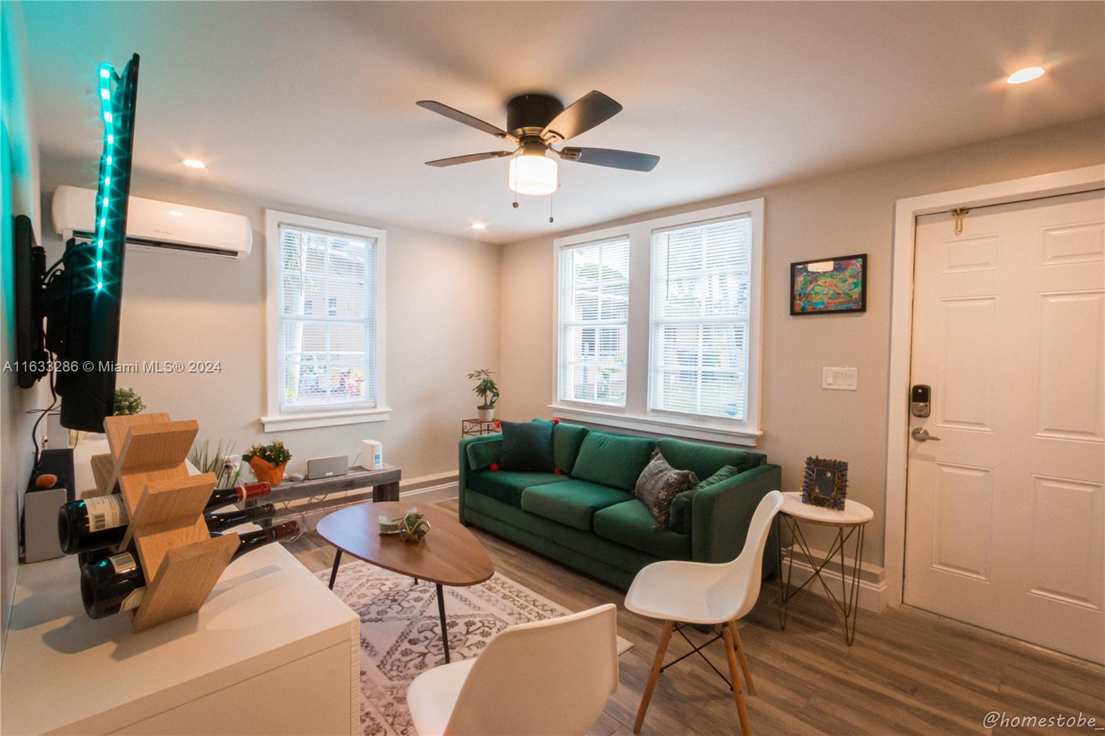 a living room with furniture and a window