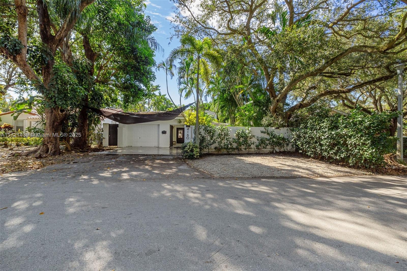 a view of a house with a tree