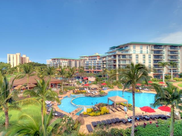 a view of a swimming pool with an outdoor seating