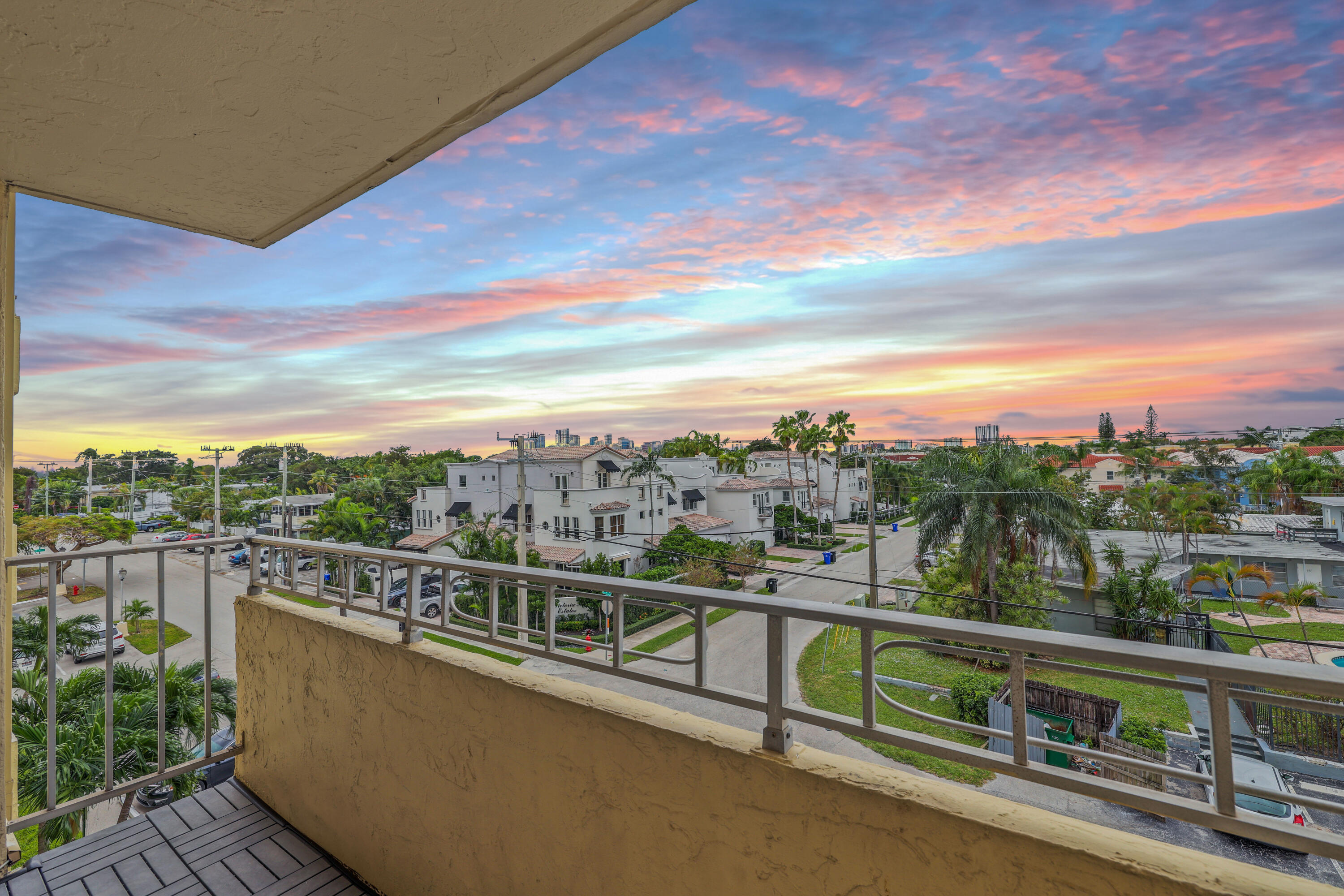 a view of a city from a balcony with city view