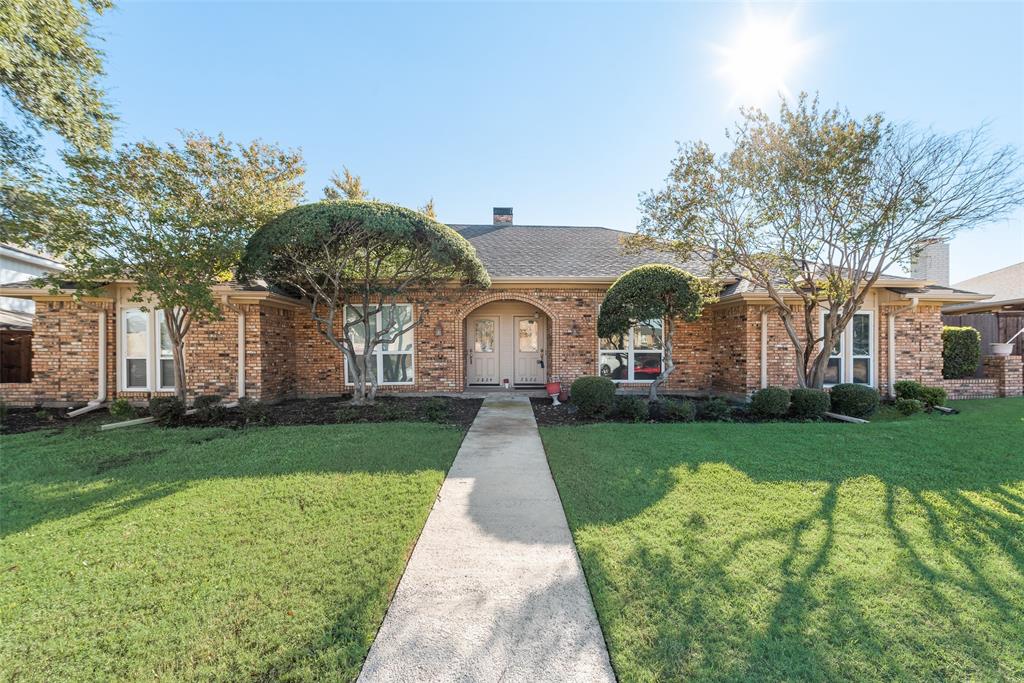 front view of a house with a yard