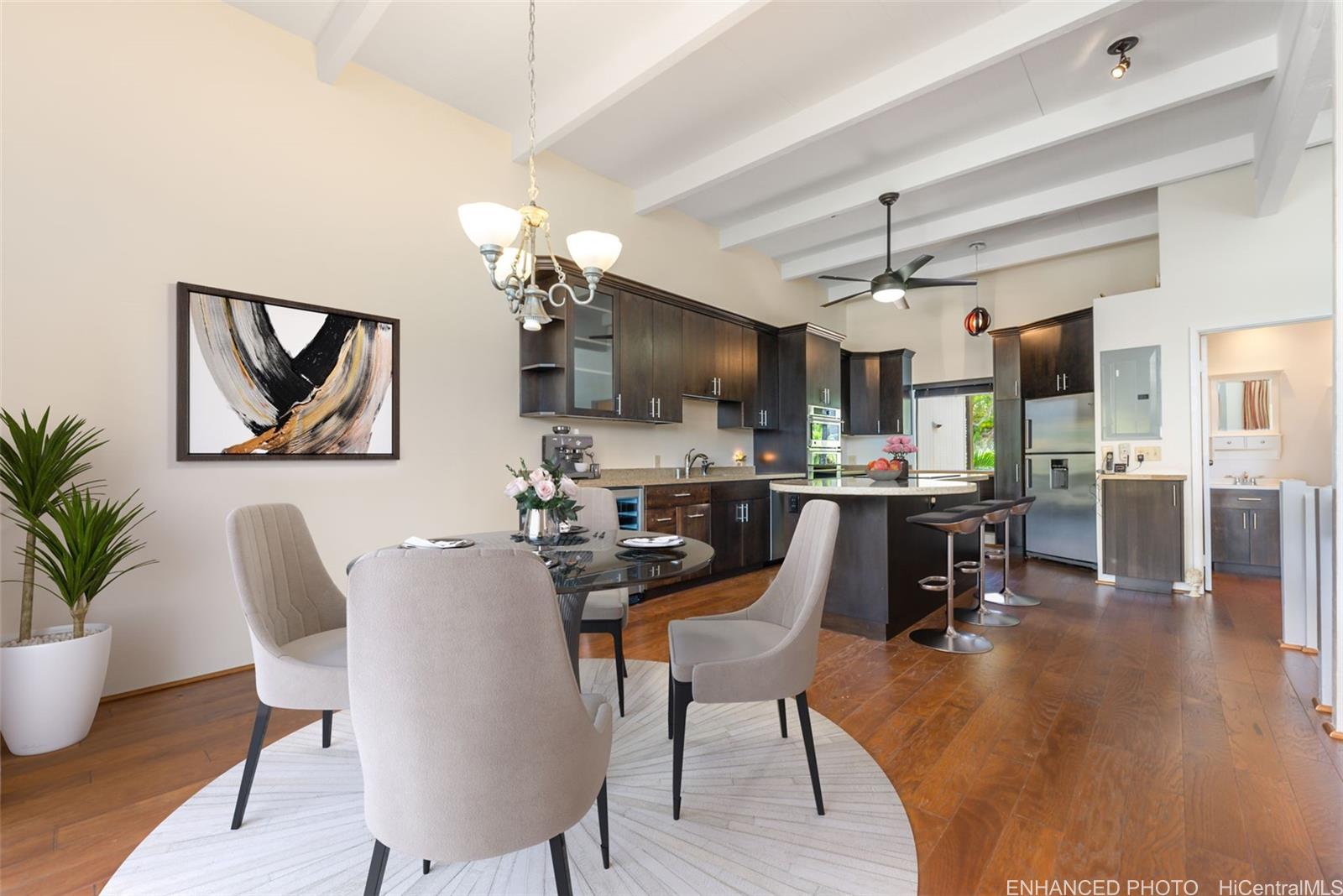 a view of a dining room with furniture and wooden floor