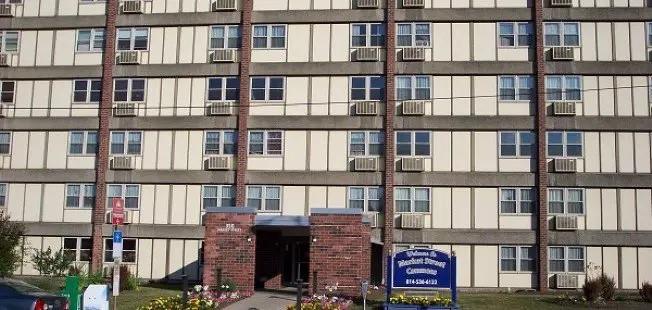 a view of a brick building from a balcony