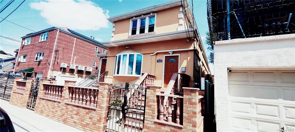 View of front of home featuring a garage