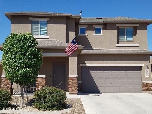 a front view of a house with a garage