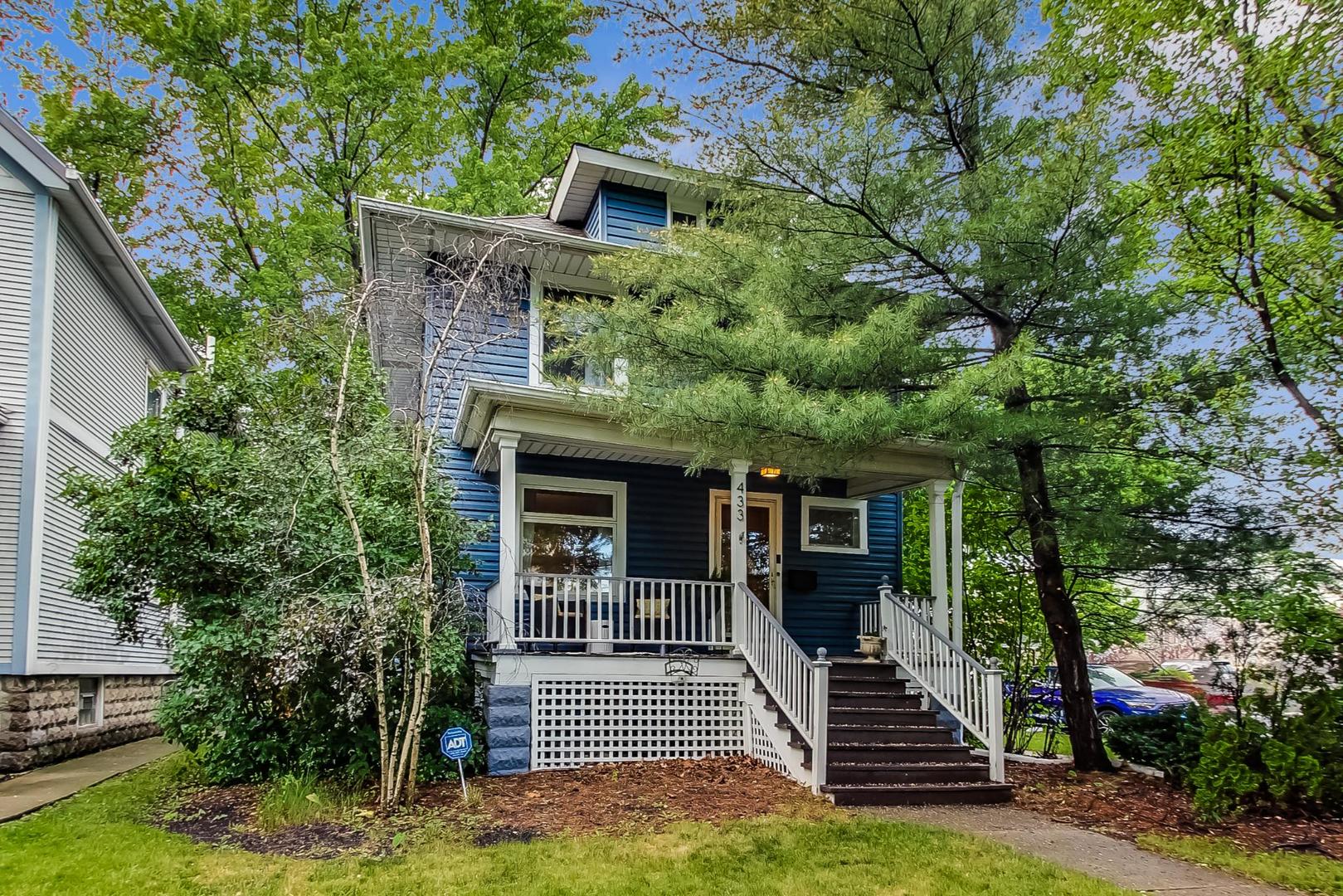 a front view of a house with stairs