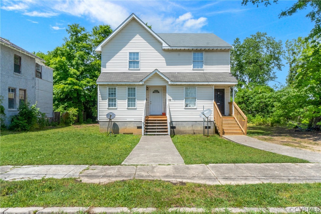 a front view of a house with a yard