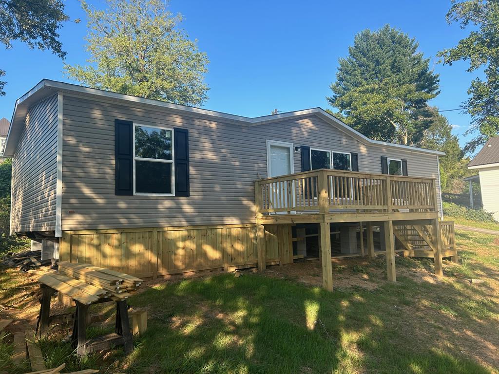 a front view of a house with yard