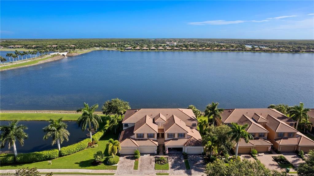 an aerial view of a house with a lake view