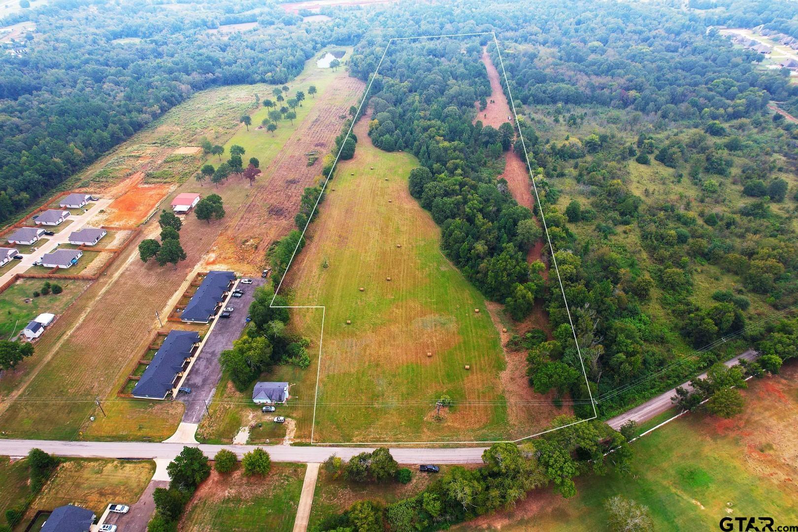 an aerial view of residential house with outdoor space and swimming pool