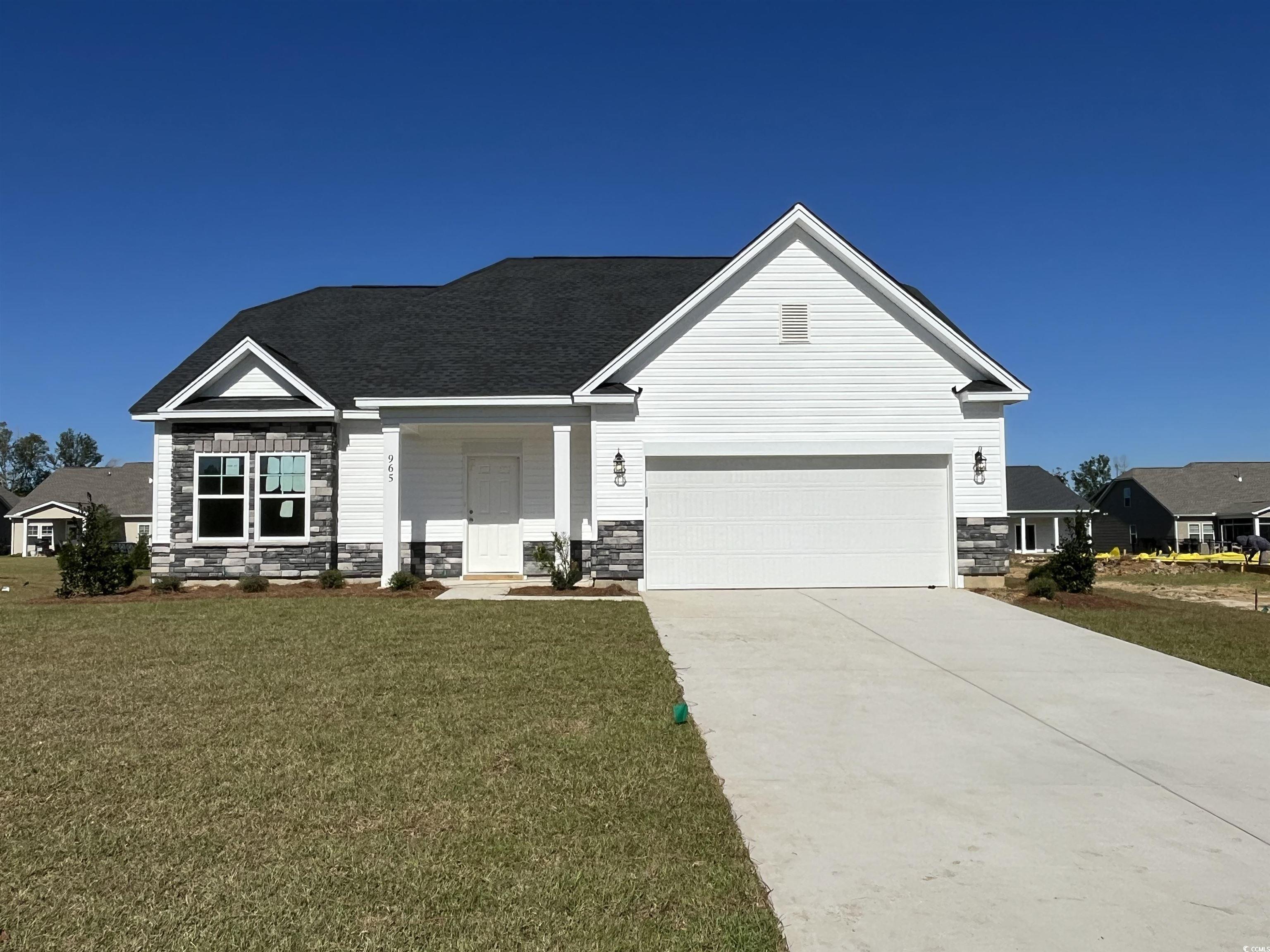 View of front of house with a front yard