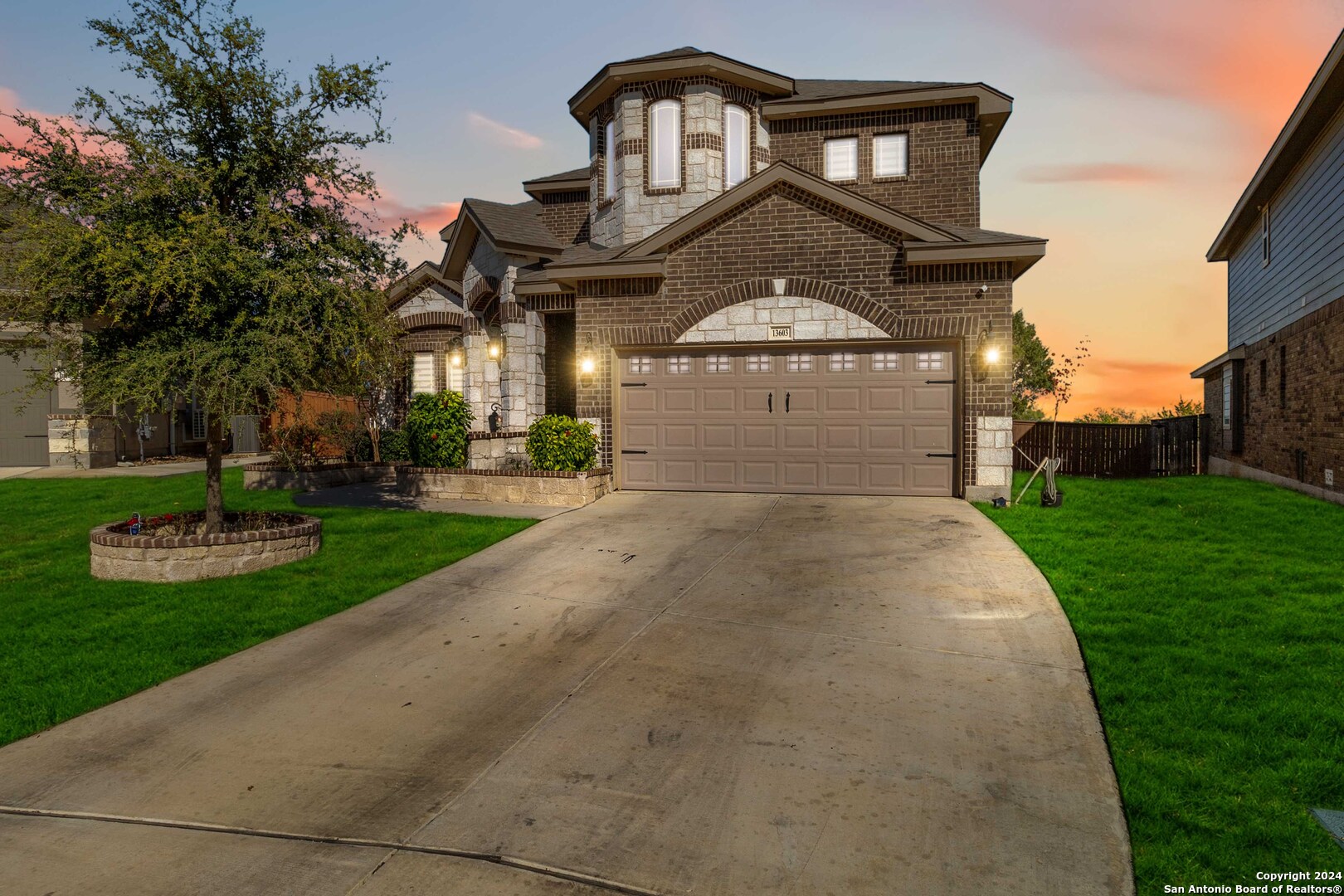 a front view of a house with a yard