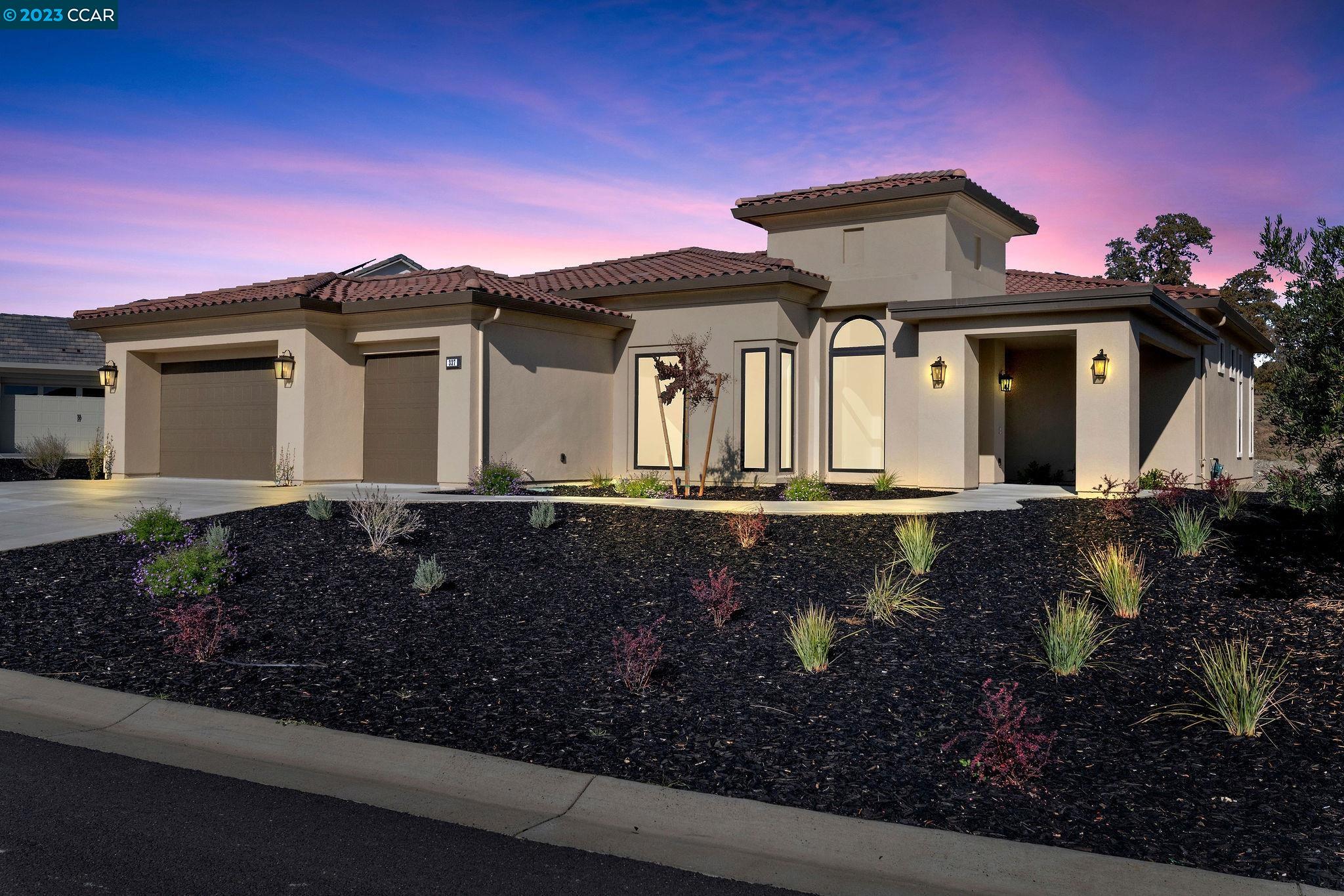 a front view of a house with a yard