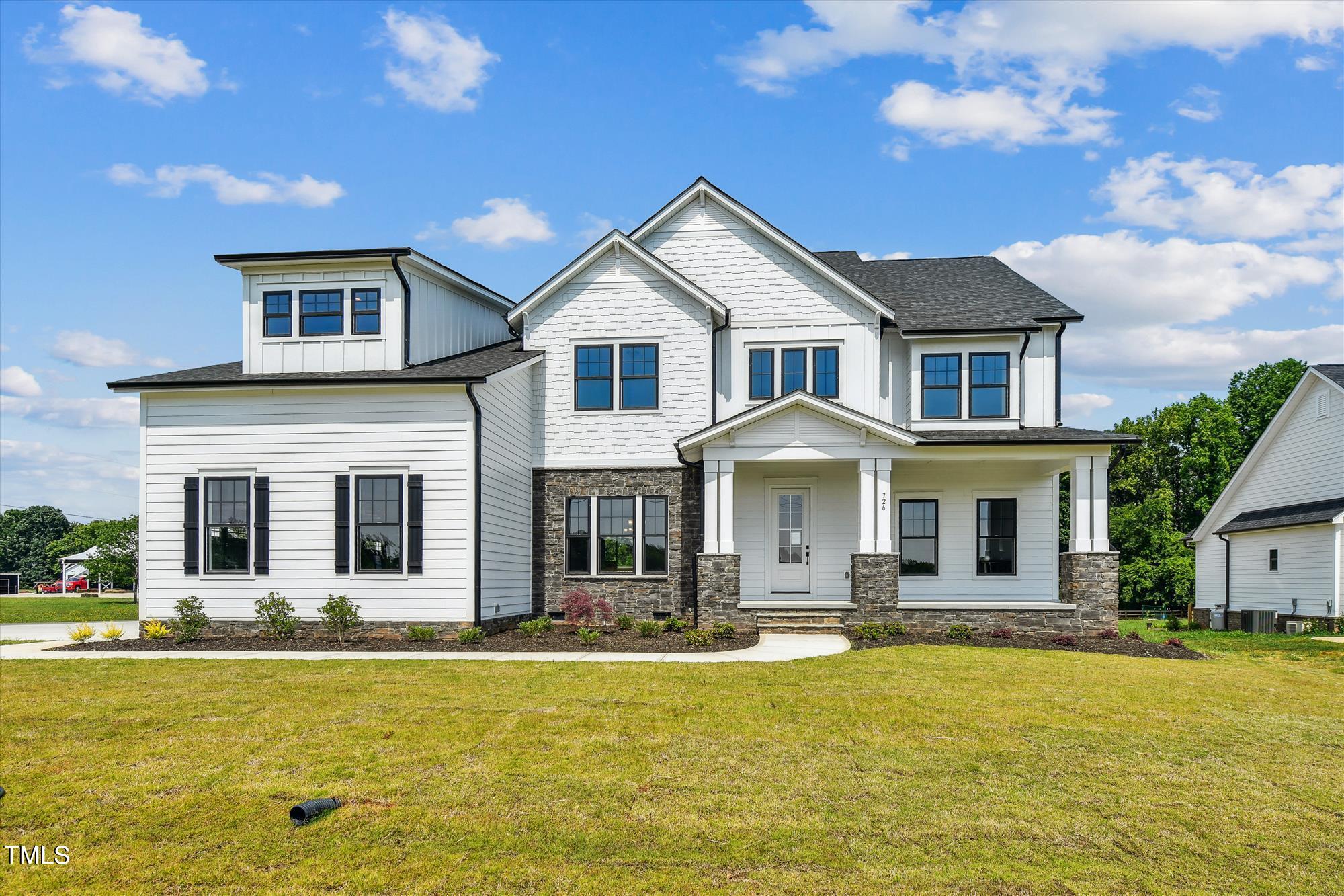 a front view of house with yard patio and swimming pool