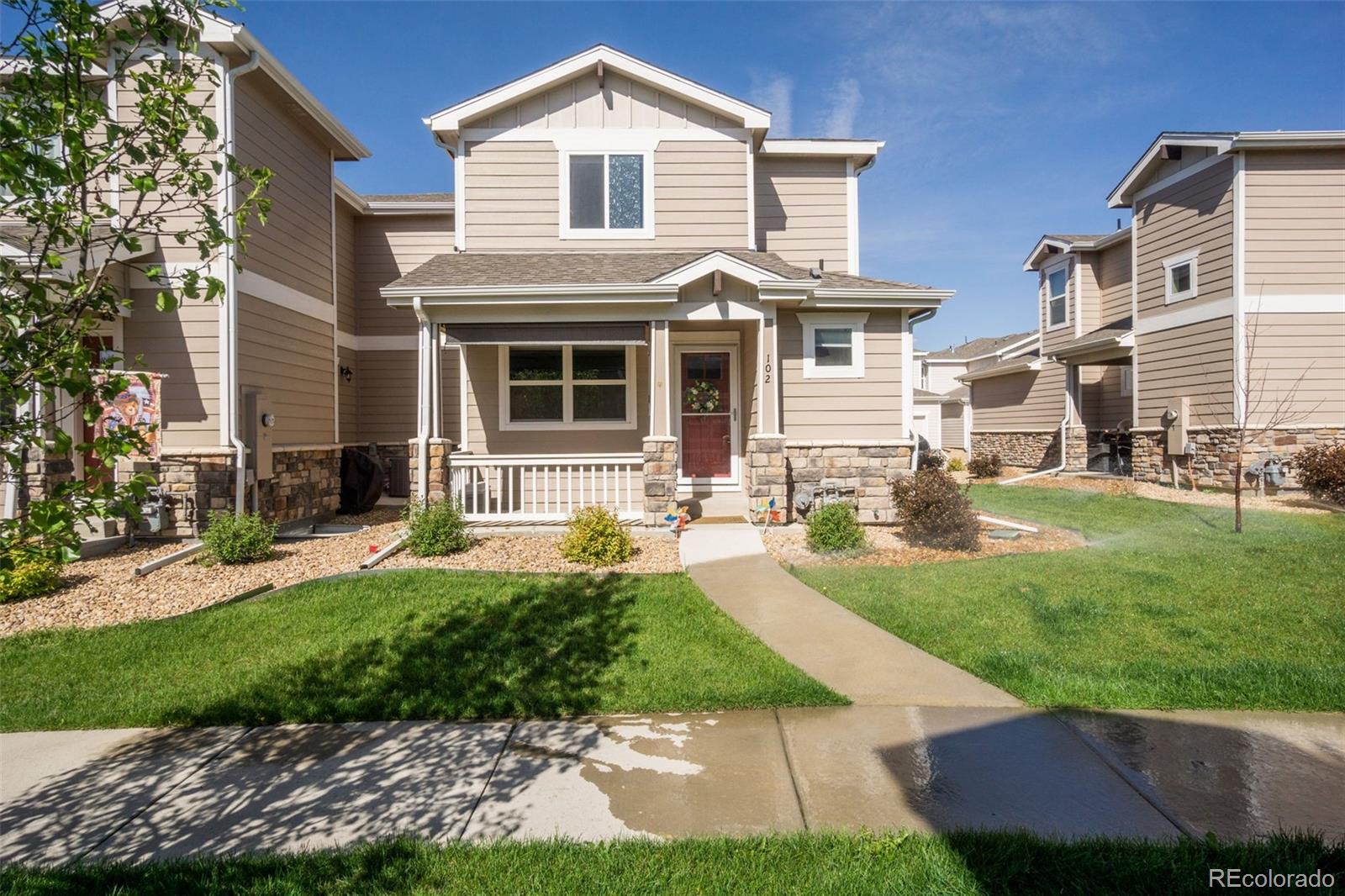 a front view of a house with a yard