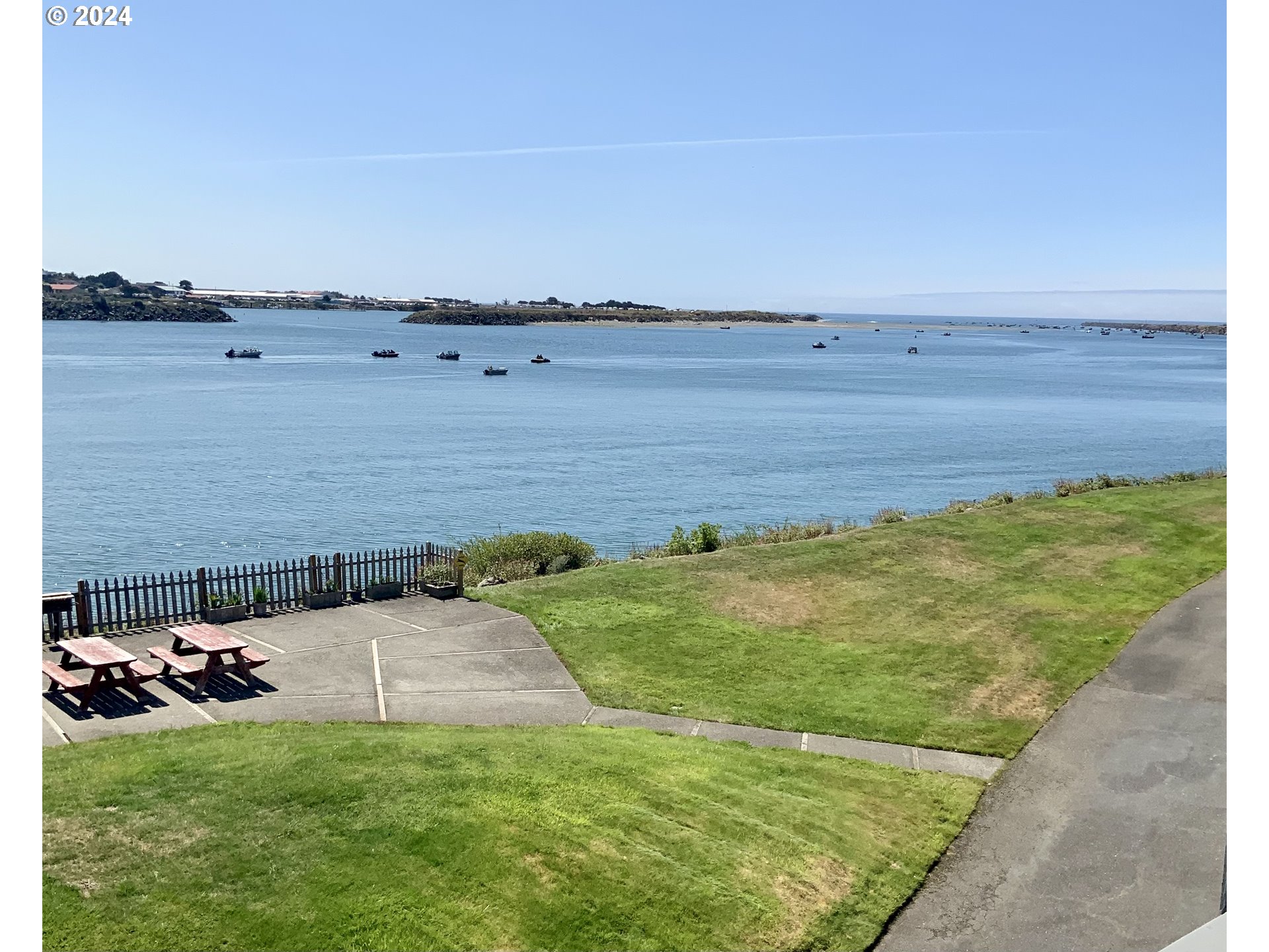 a view of a lake with a yard