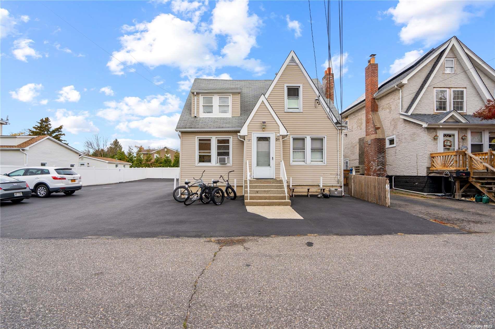 a view of a car park in front of house