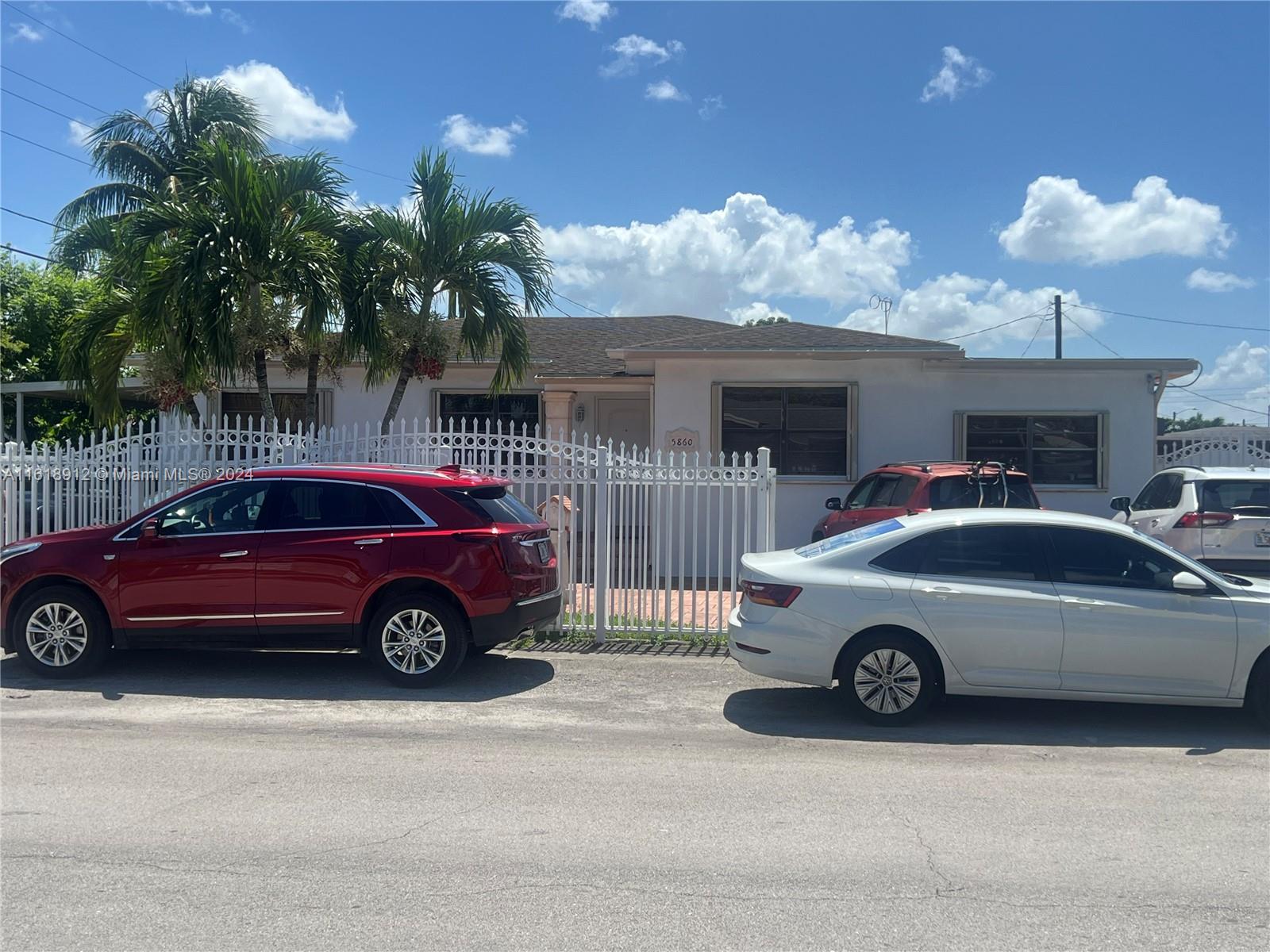 a car parked in front of a house