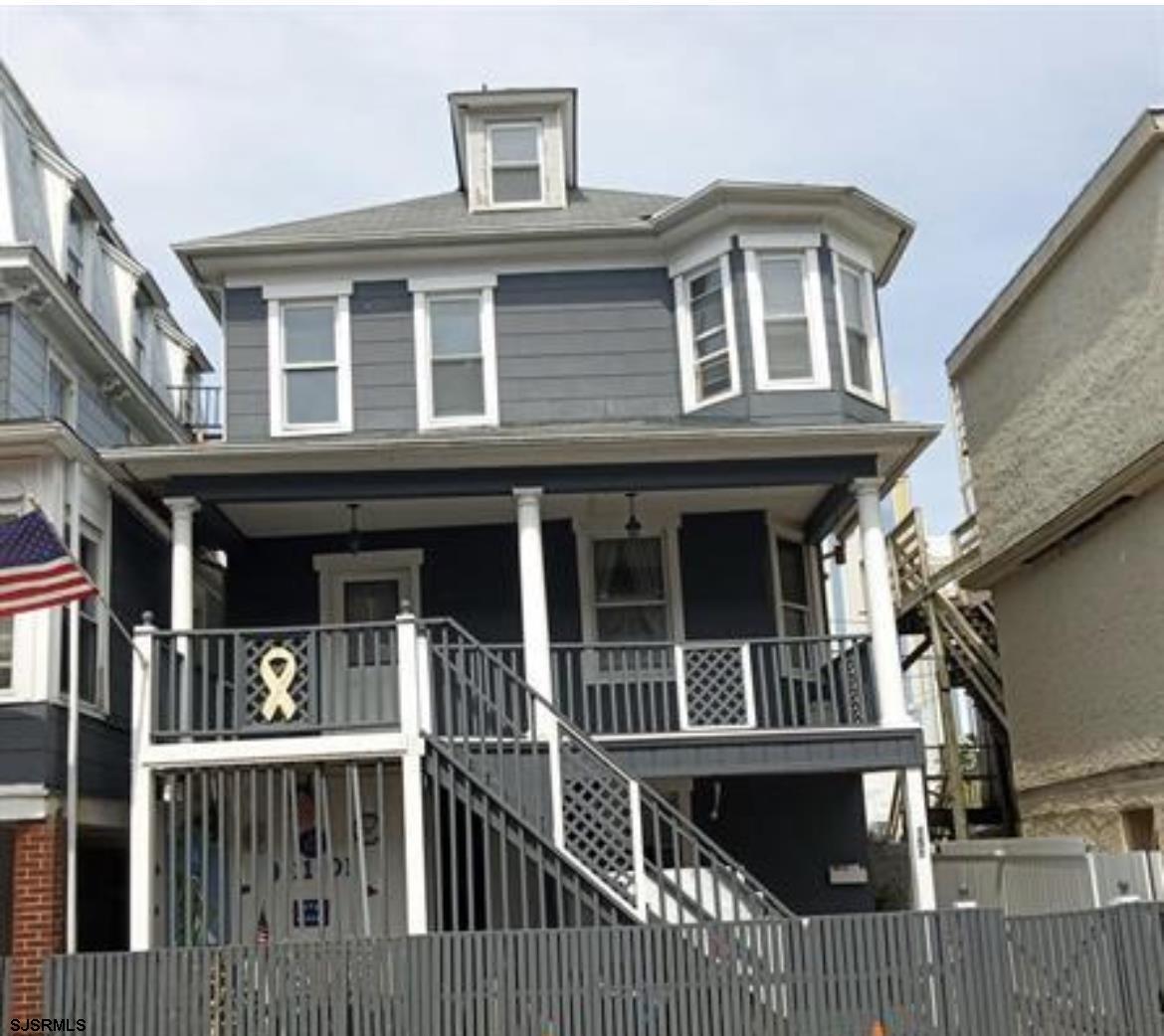 a front view of a house with a porch