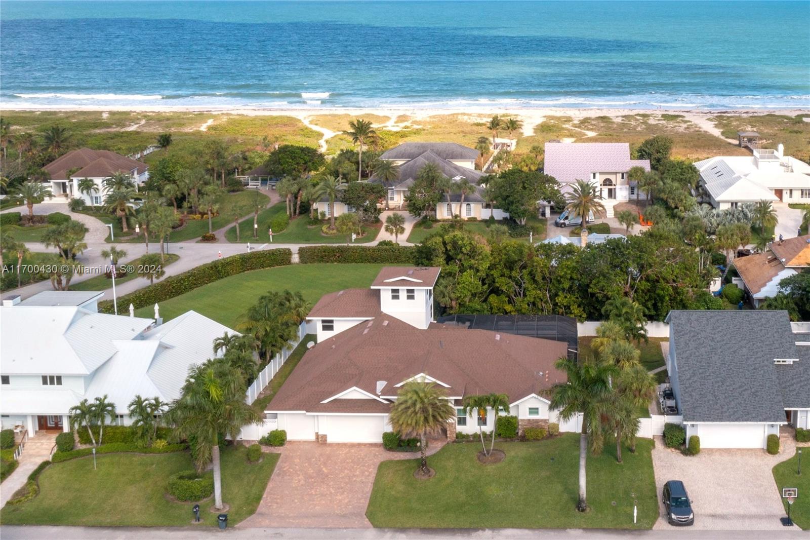 an aerial view of a house with yard swimming pool and outdoor seating