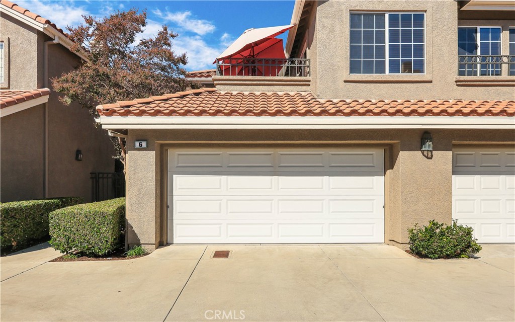 a front view of a house with a garage