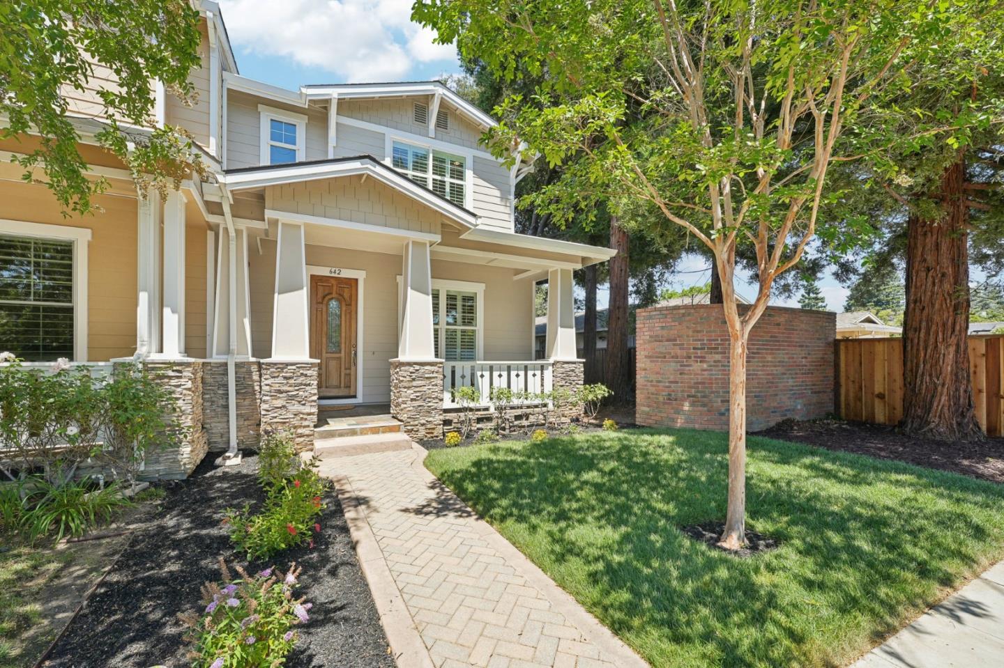 front view of a house with a yard