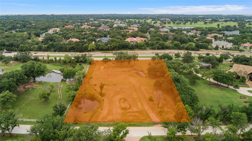 an aerial view of lake residential house with outdoor space and trees