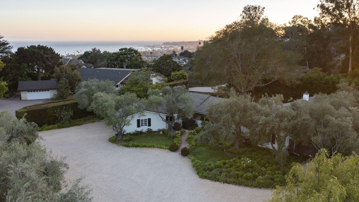 an aerial view of a house with mountain view