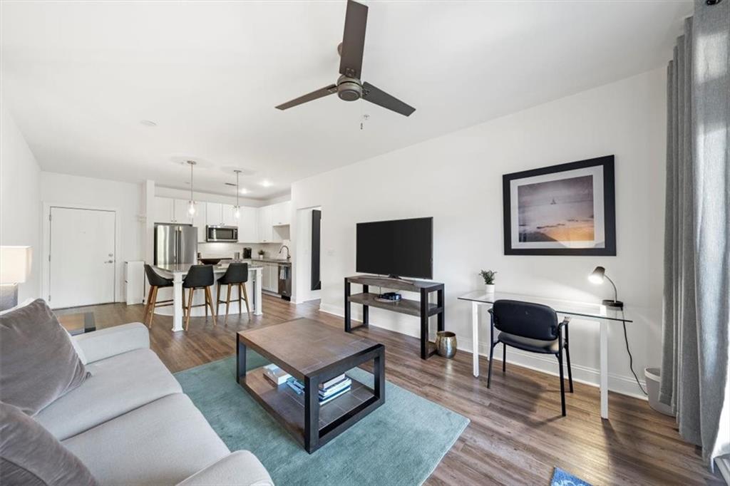 a living room with furniture and a flat screen tv