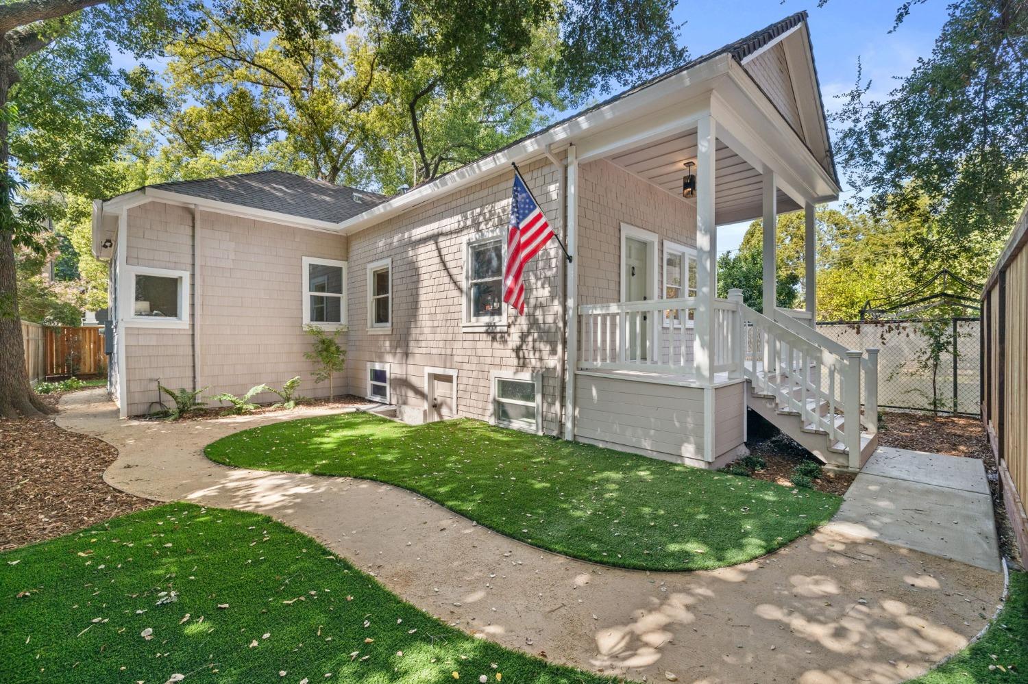 a front view of a house with garden