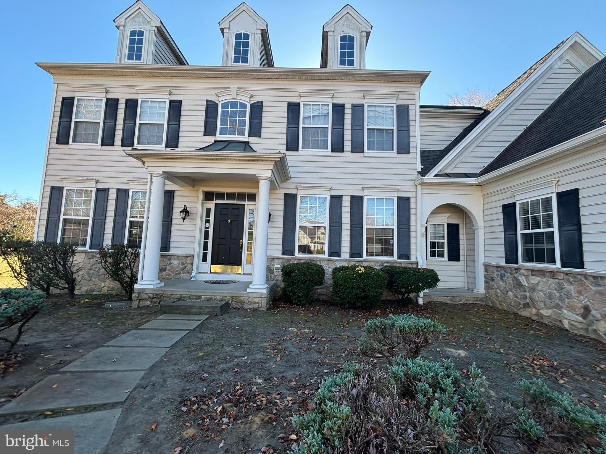 a front view of a house with yard