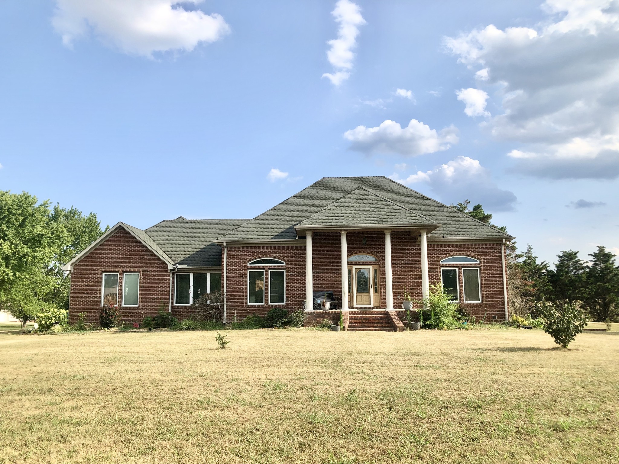 a front view of a house with a yard