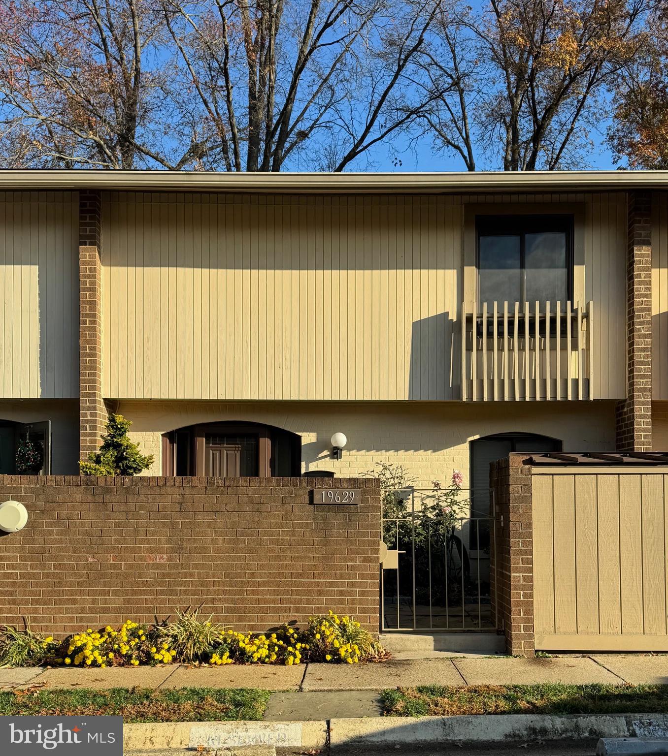 a front view of a house with garage