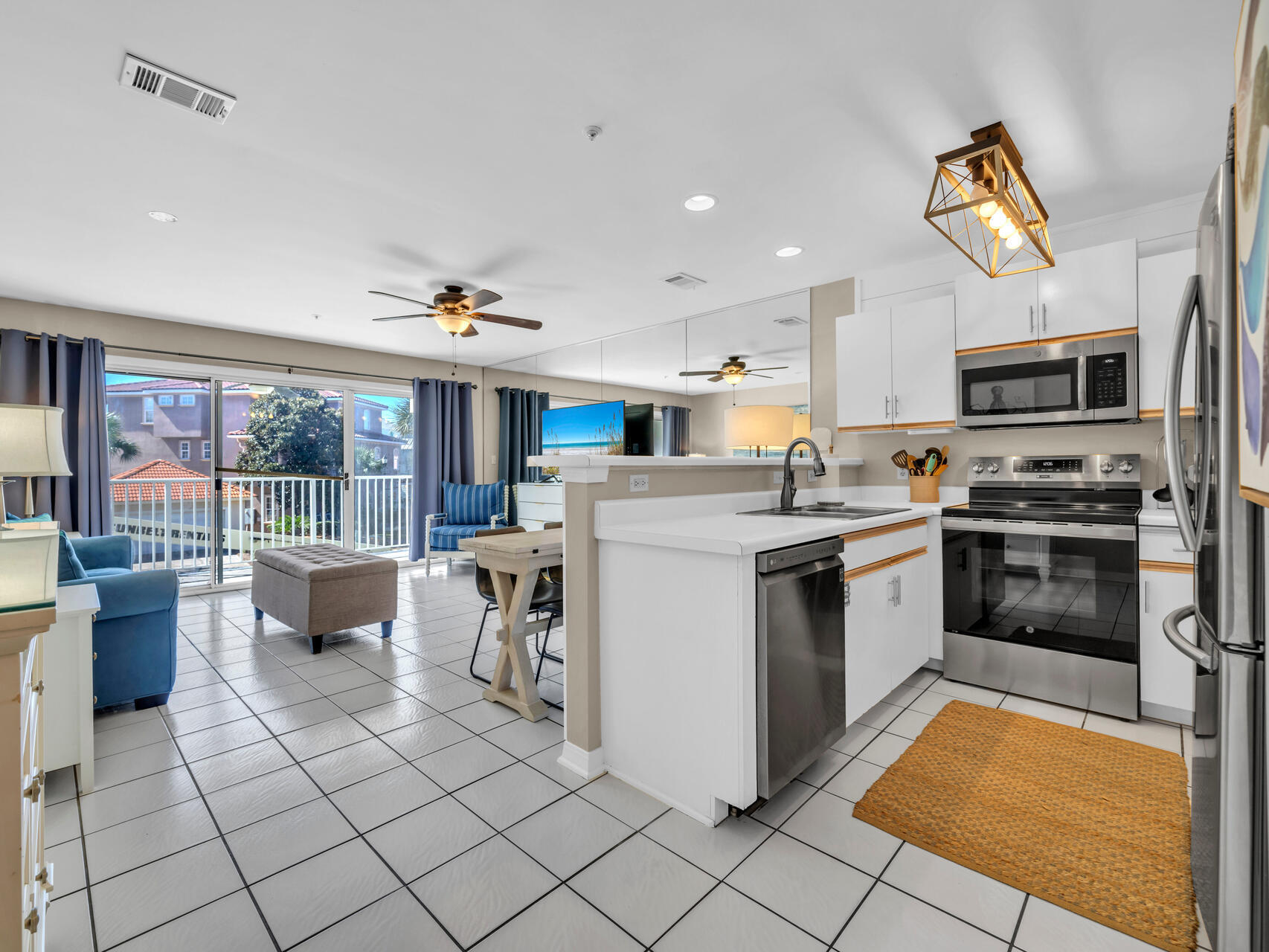 a kitchen with a sink appliances and cabinets