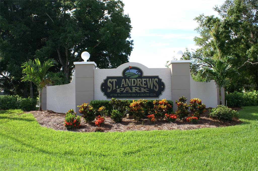 a view of a sign board with yard