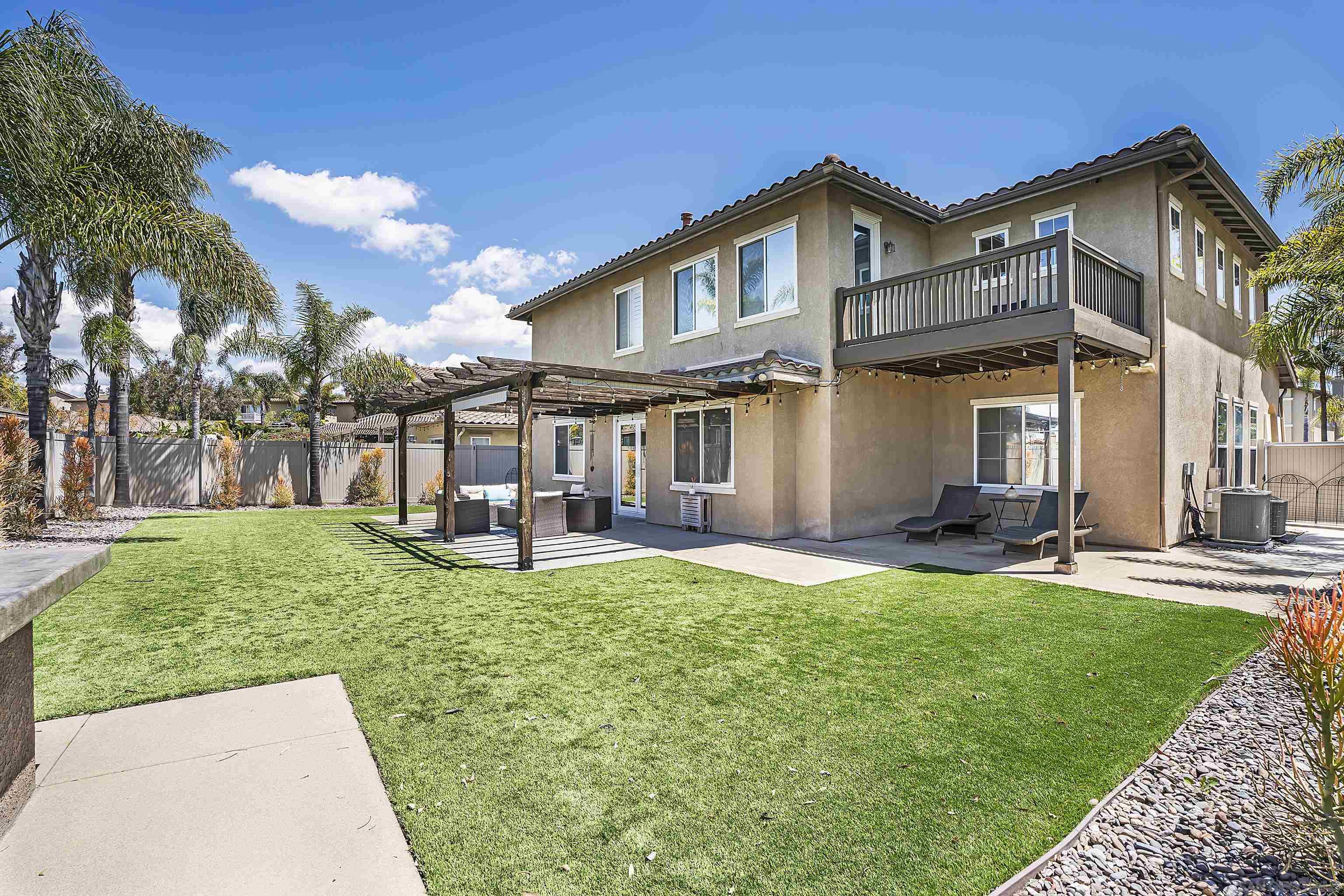 a view of a house with a yard porch and sitting area