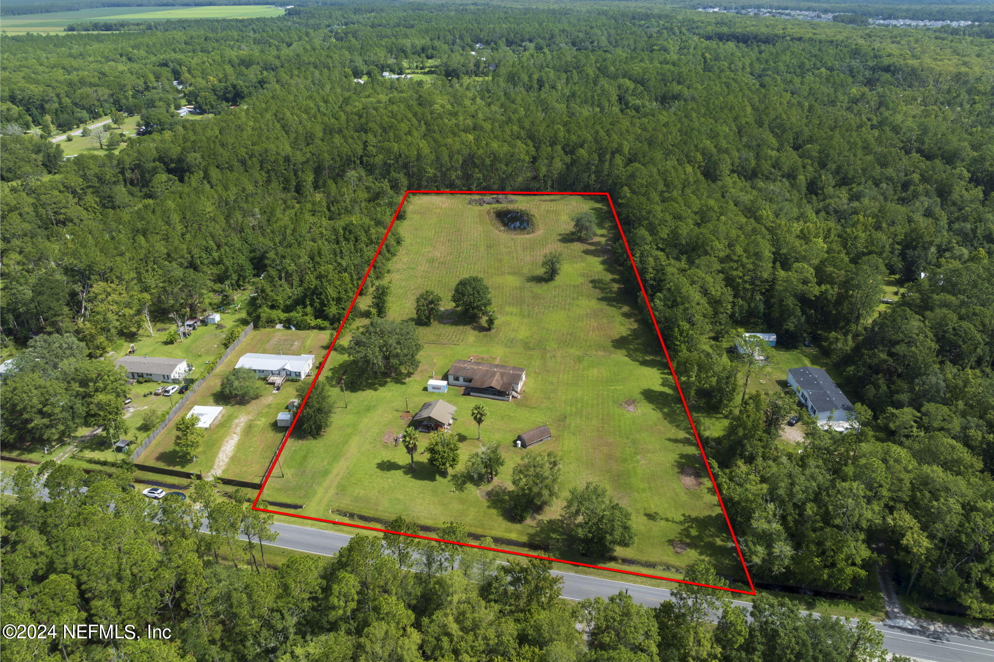 an aerial view of residential house with trees