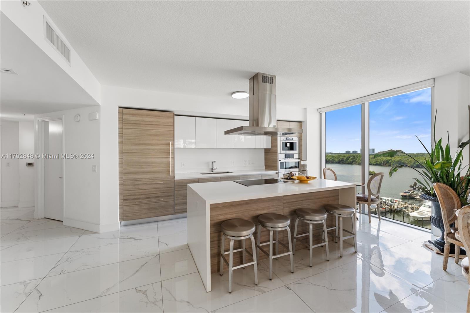 a kitchen with a stove a refrigerator and a table