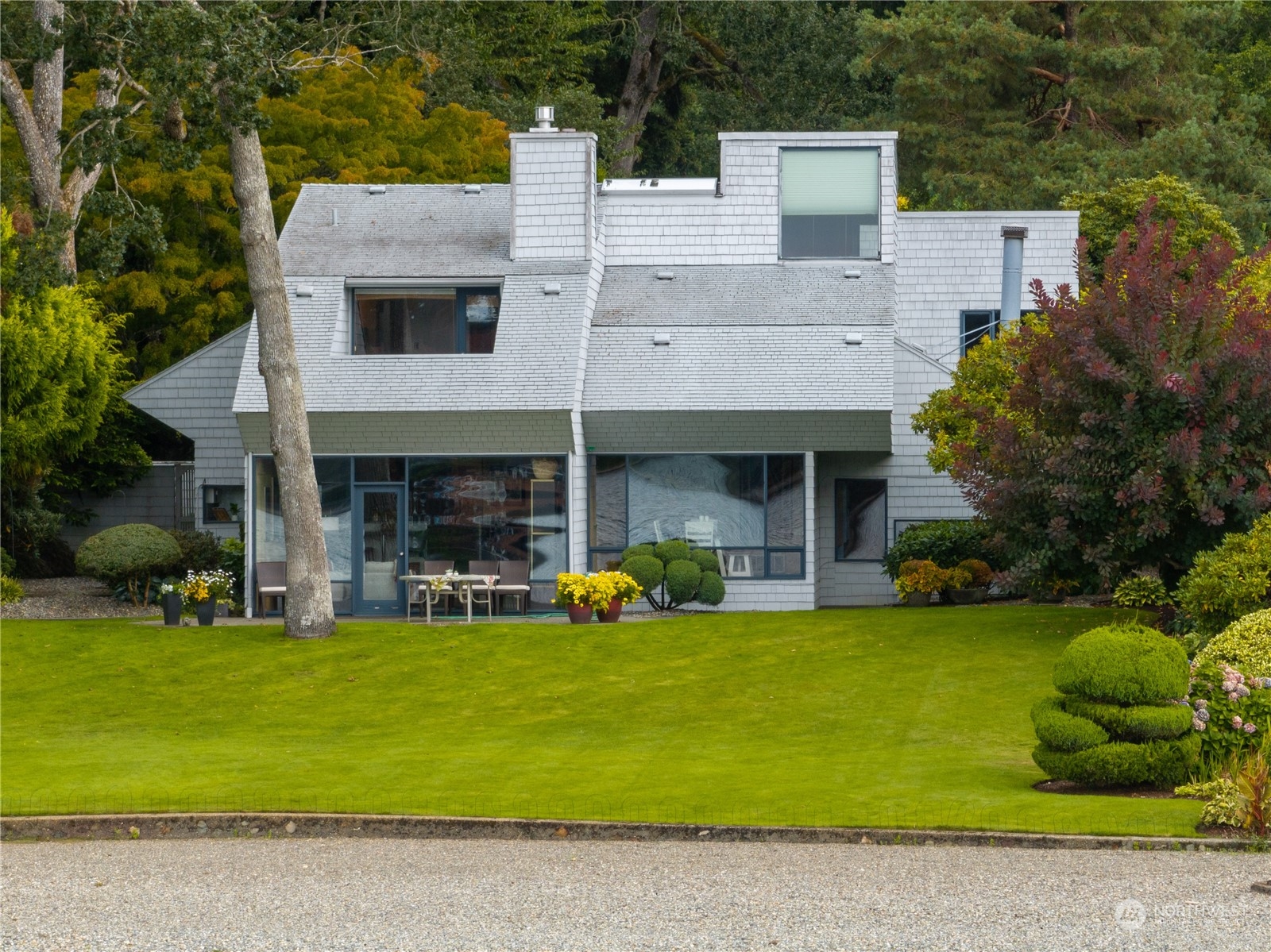 a view of a house with backyard porch and sitting area